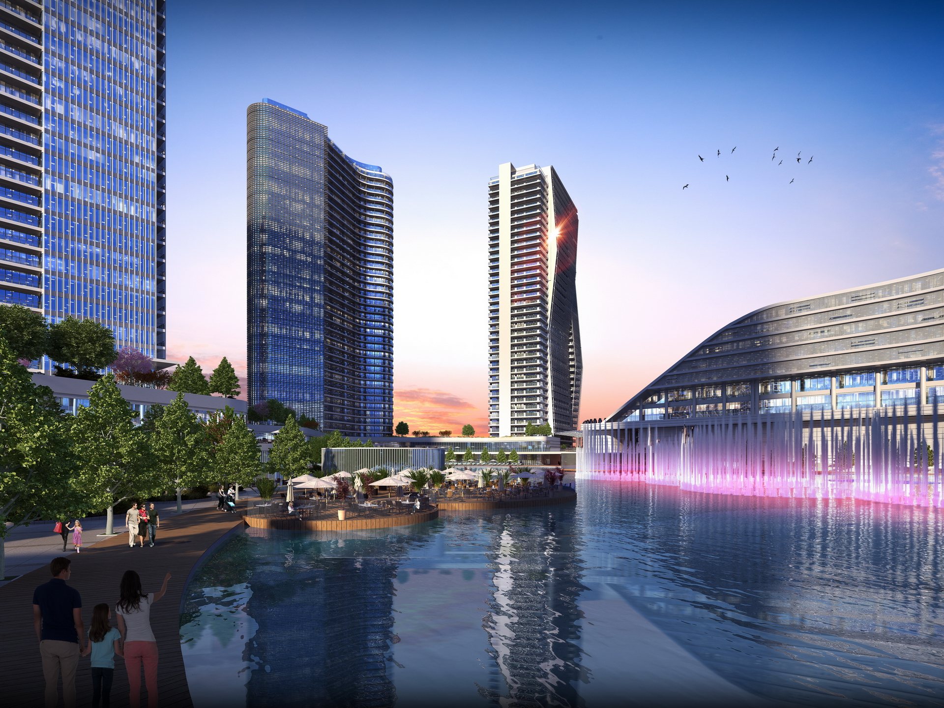 Modern towers and a curved waterfront building